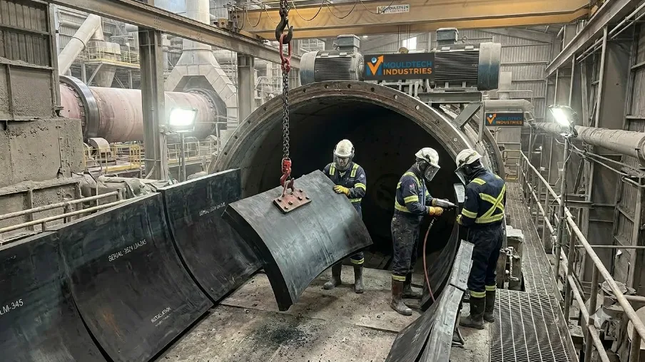 Technicians installing mill liner By Mouldtech